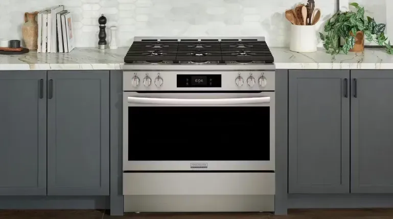 Frigidaire Professional dual fuel range with Air Fry in a modern stainless steel kitchen setting.